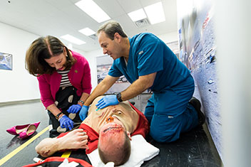 Shelley Berkley looks over a simulated patient. 