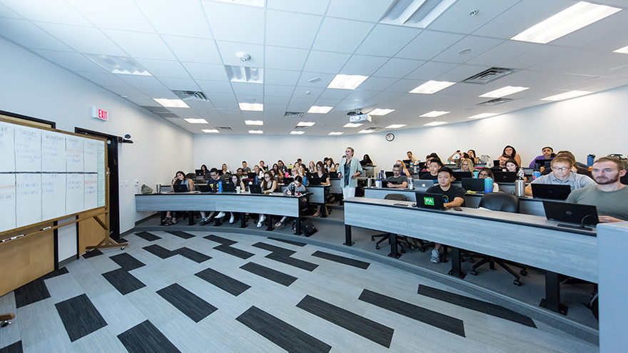 A lecture hall filled with students. 