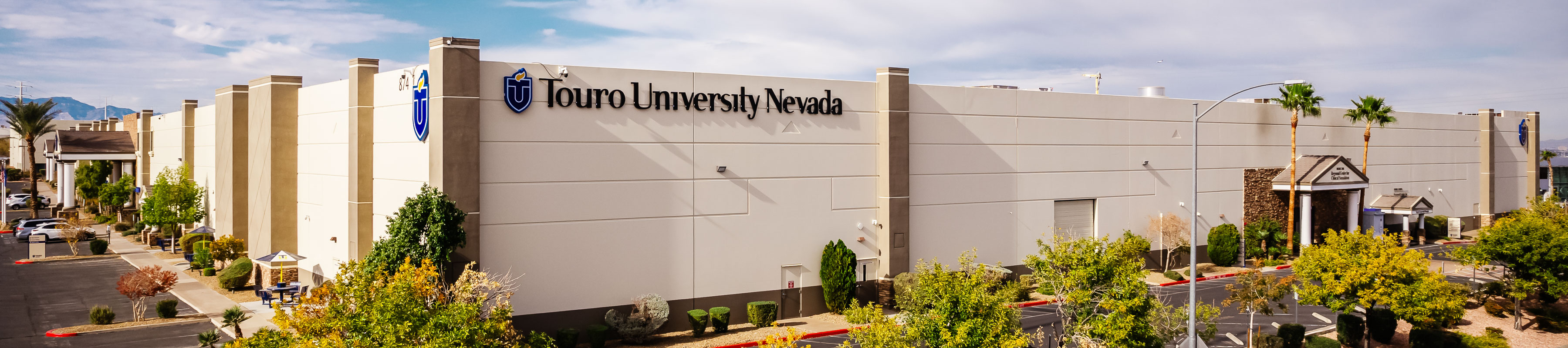 Exterior view of the Touro University Nevada building, featuring the university logo