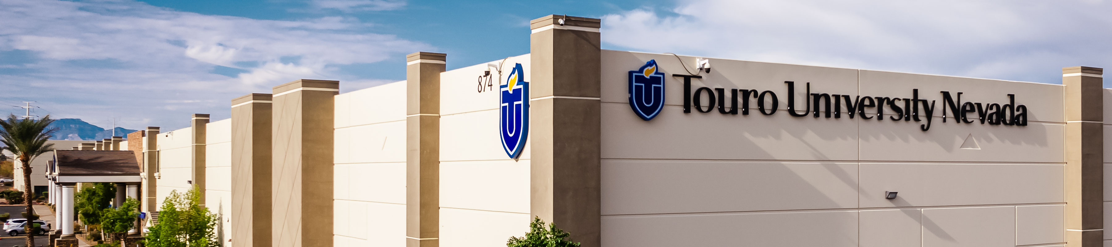 Exterior view of the Touro University Nevada building, featuring the university logo