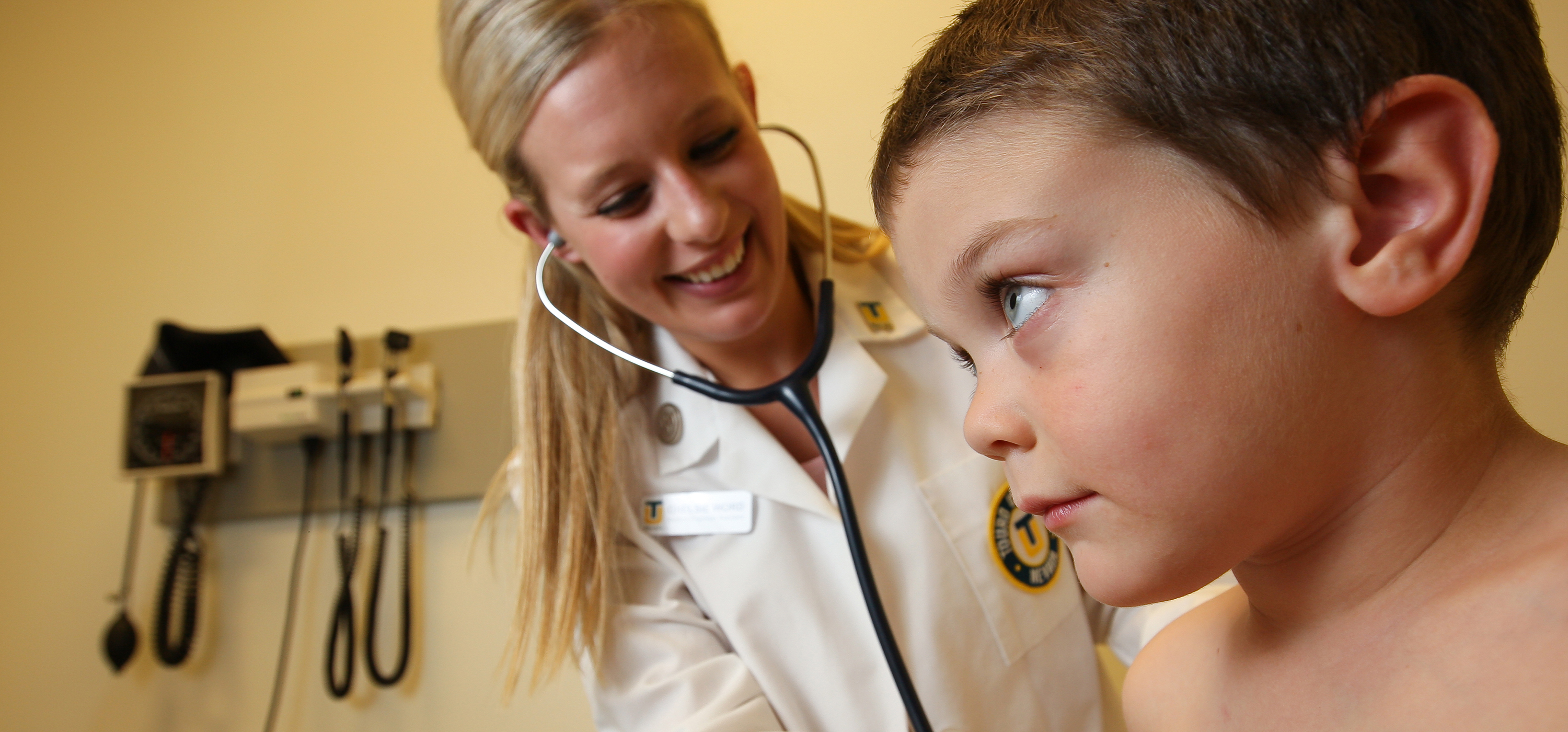 A child being examined by a healthcare provider. 