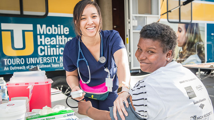 A student with a patient at the Mobile Healthcare Clinic. 