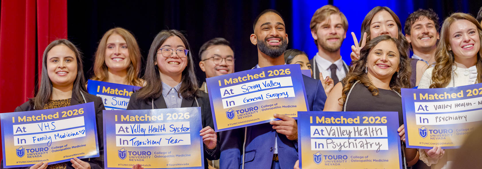 Medical students share their residency match results on stage during Touro Nevada’s Match Day event.