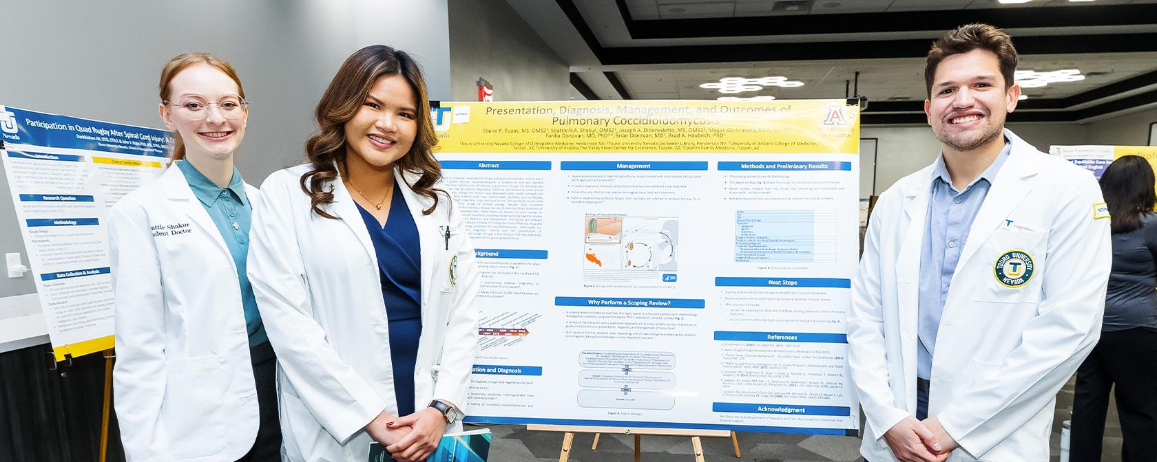 Touro medical students present their poster board at the 2023 Research Day event.