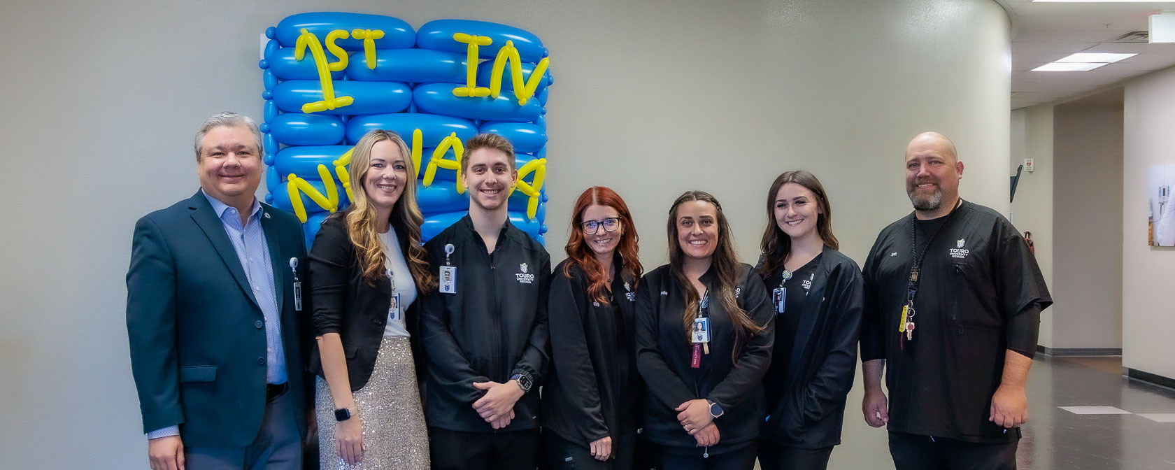 Staff celebrate the Simulation Centers full accreditation status with a group photo at a special event.