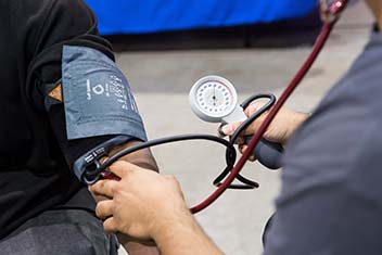 A stethoscope on an arm.